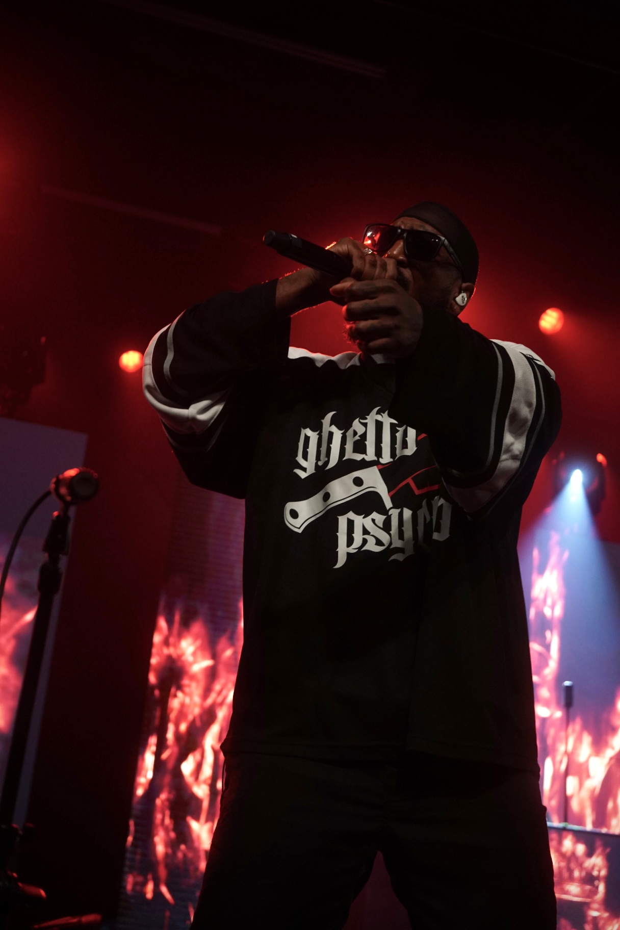 Rapper mid-verse in red light