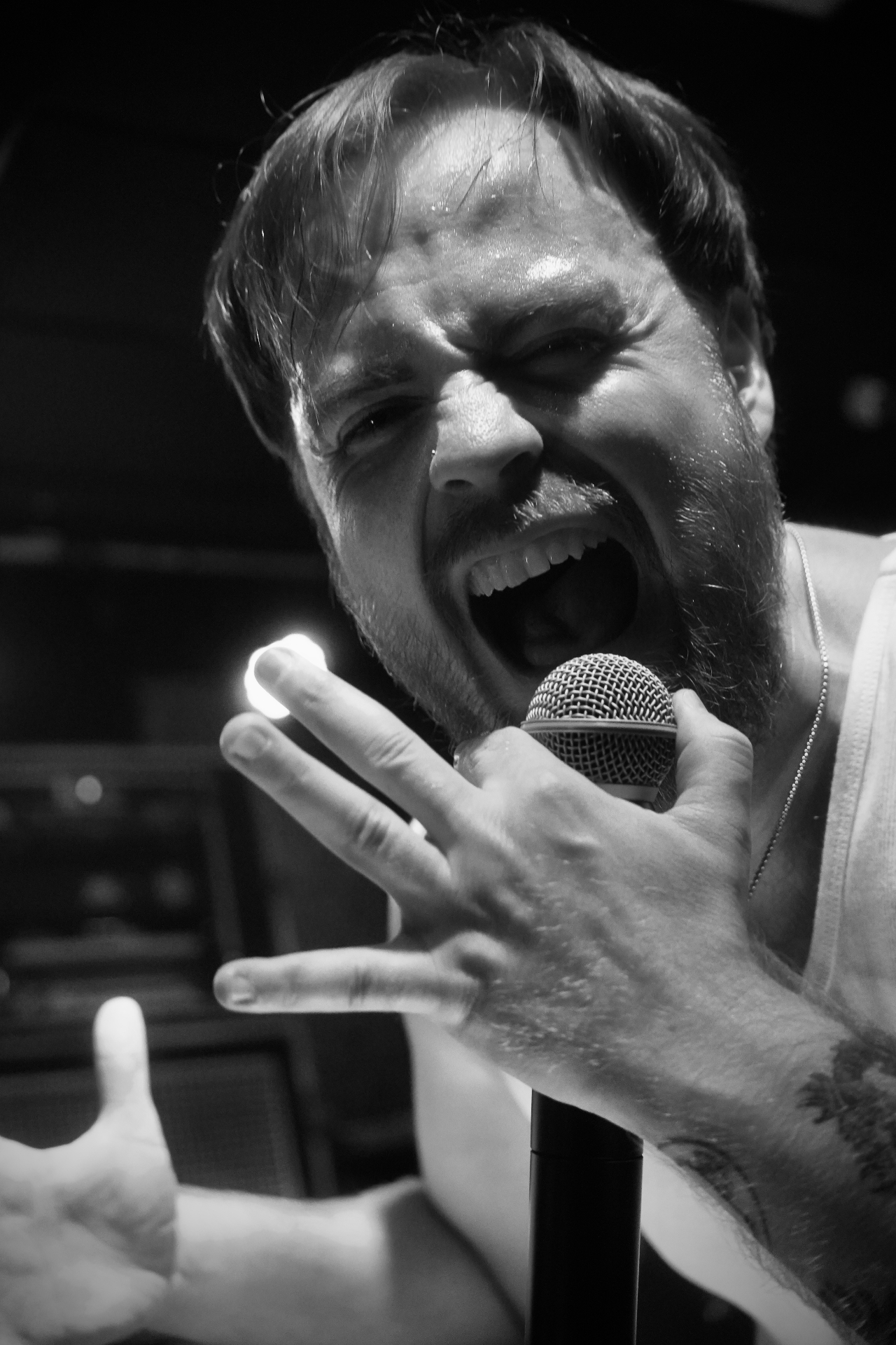 Vocalist screaming into microphone